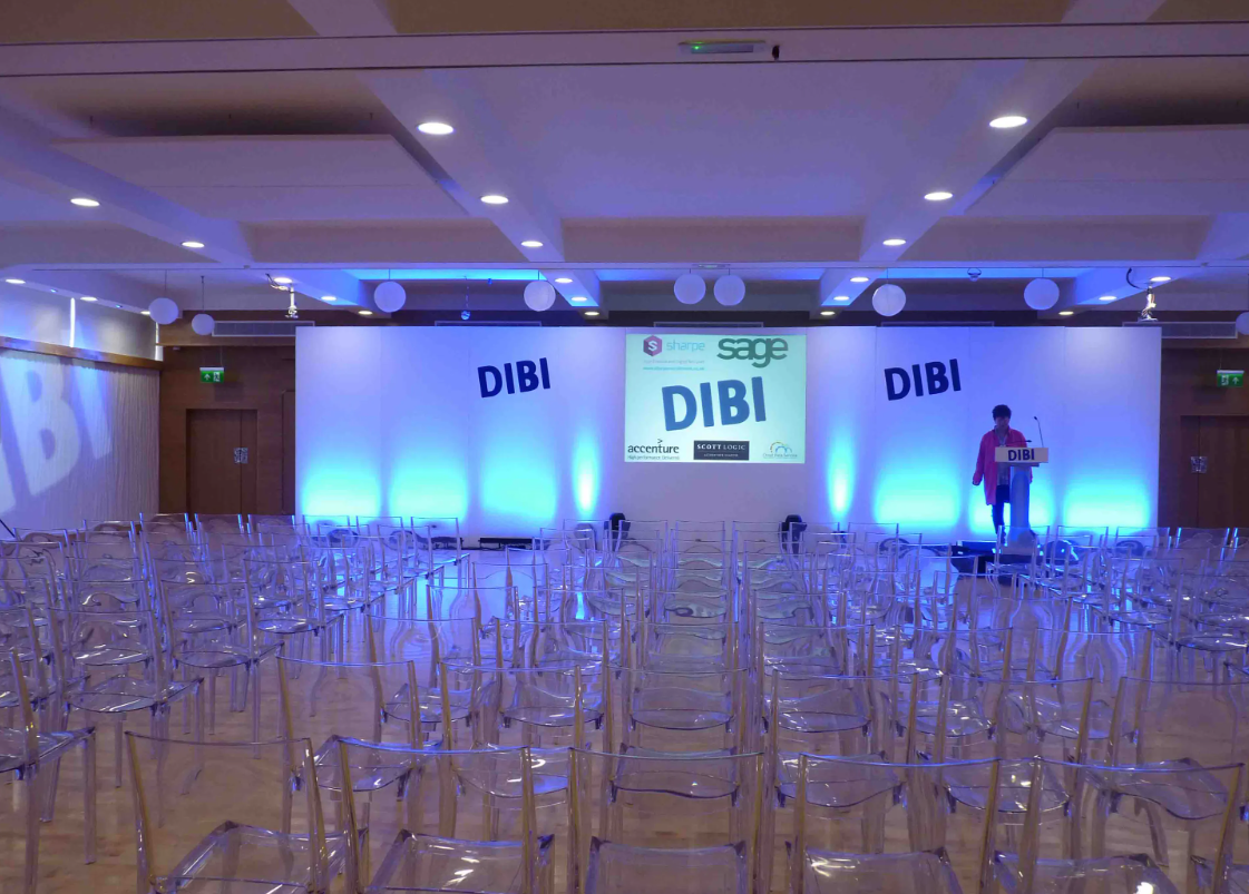 Modern conference space at The Biscuit Room, Birmingham with clear chairs and vibrant lighting. - Banner