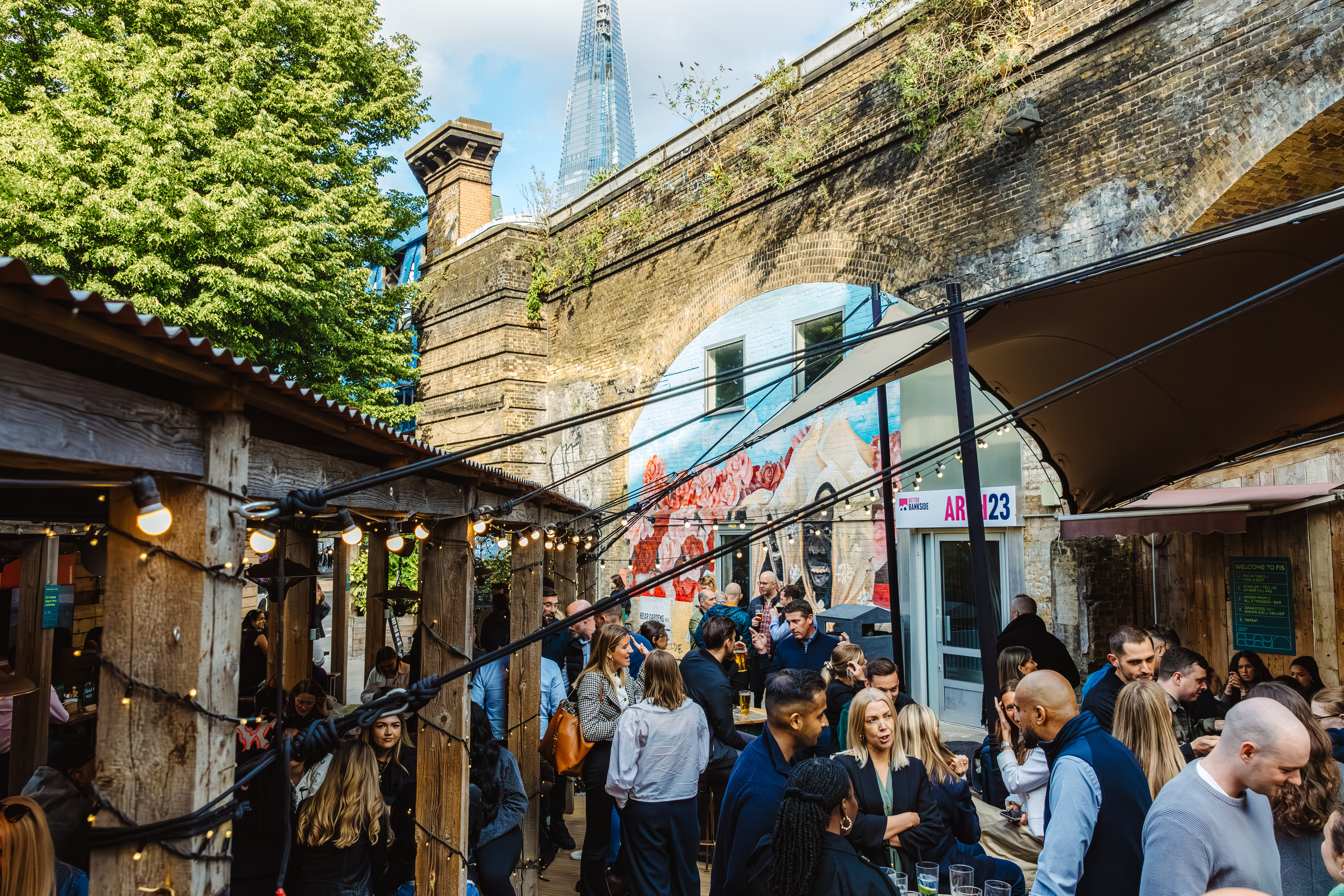 Flat Iron Square: vibrant outdoor event space with string lights for networking and gatherings