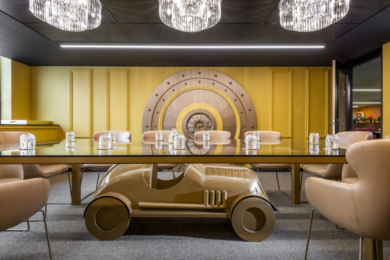 Innovative conference floor with car-shaped table for creative meetings and collaborations. - Banner