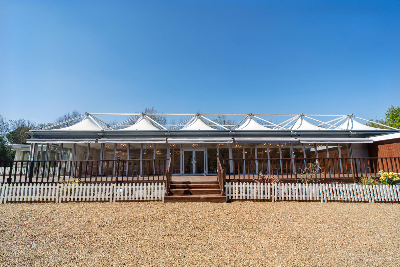 Fairway Pavilion banquet hall with modern design and outdoor space, ideal for events. - Banner