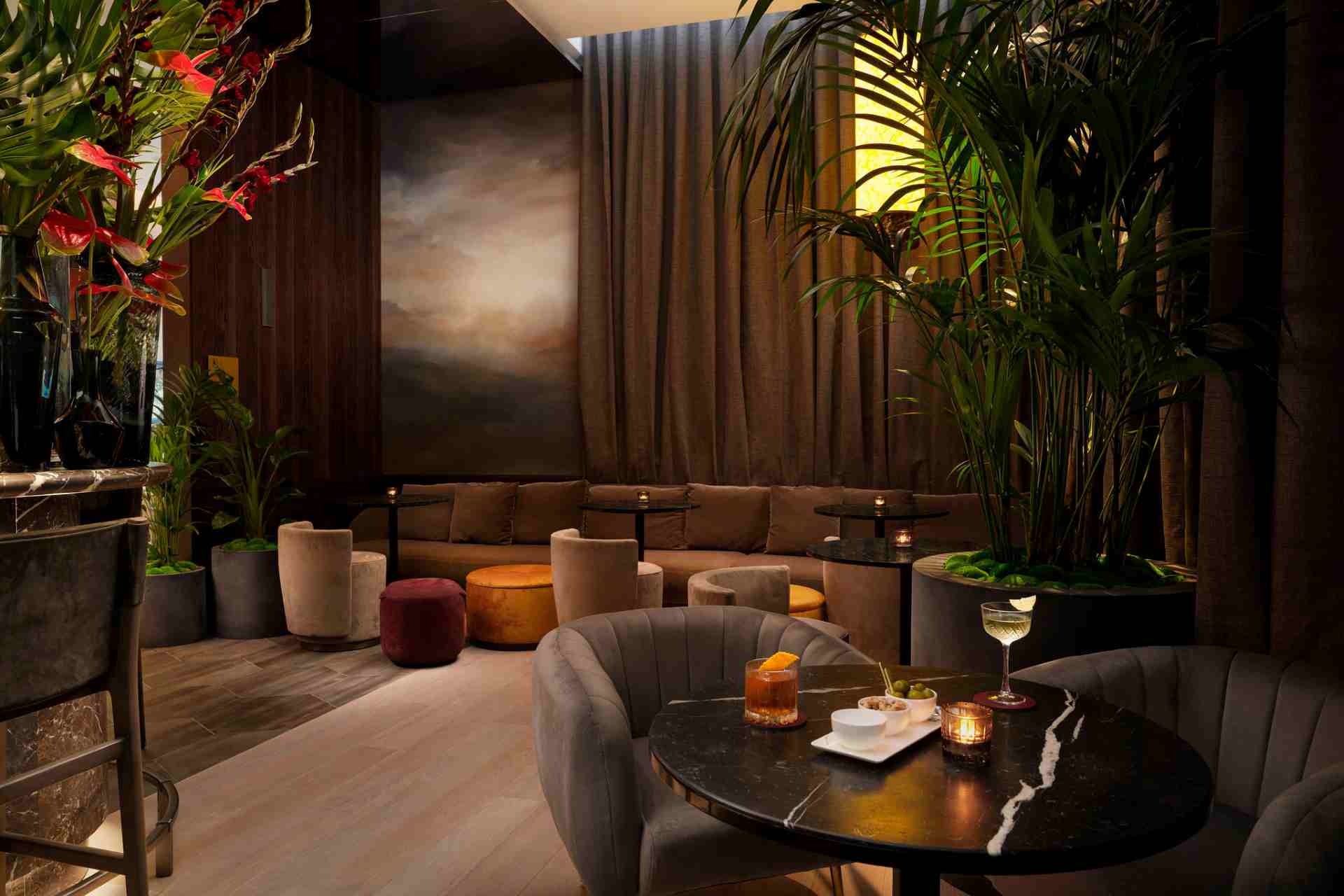 Ginger Lily Bar, London: VIP lounge with plush seating, ideal for corporate networking and events.