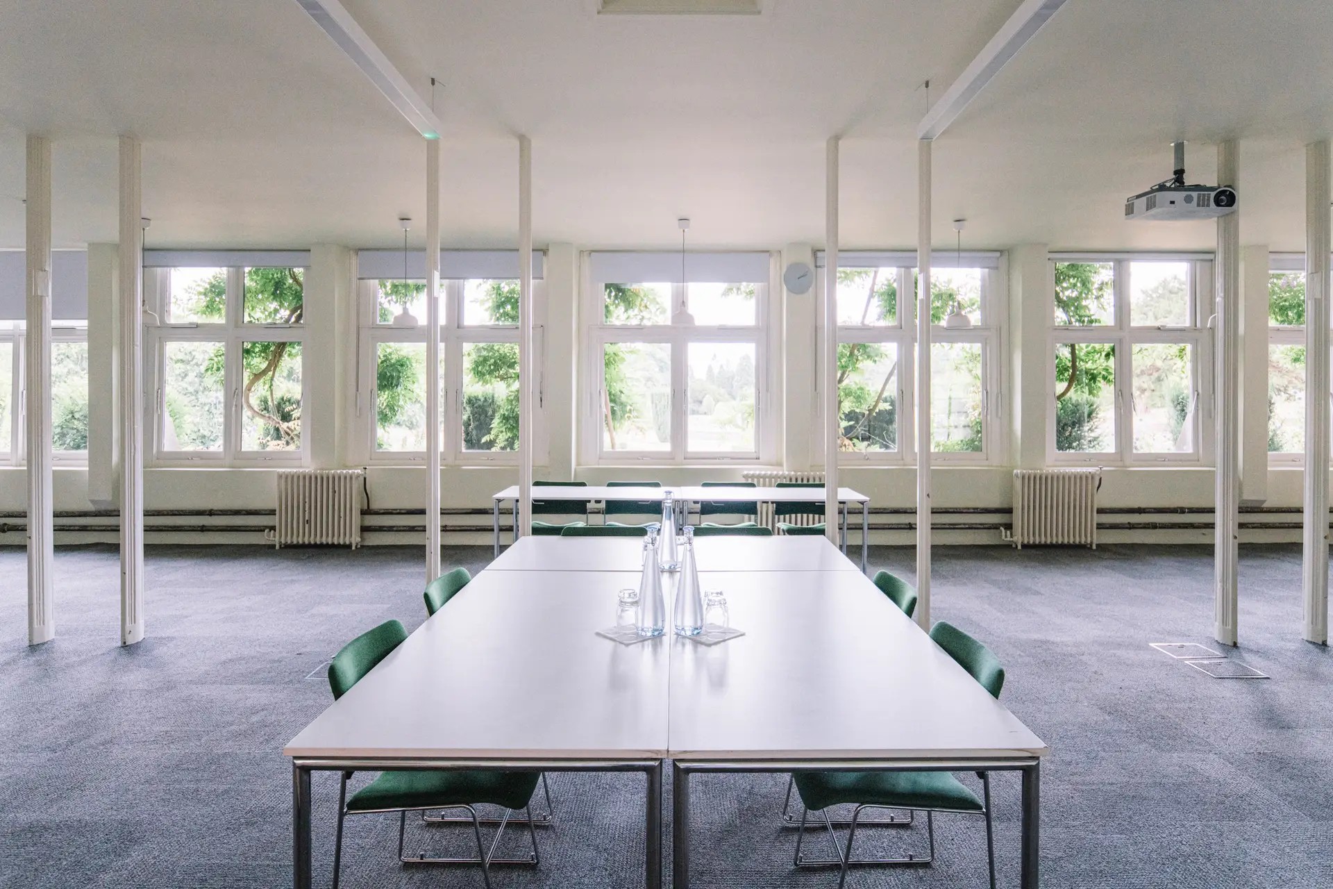 Orangery boardroom at Ashridge House with interior pillars for corporate meetings and event hire.