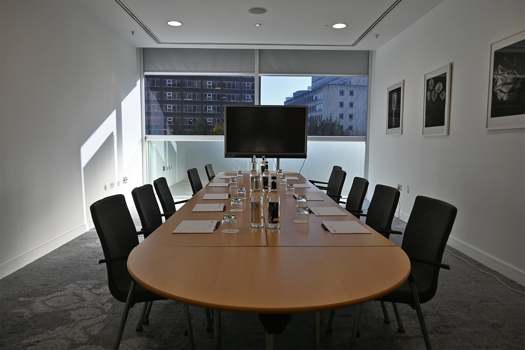 Meeting Room 6 at The Lowry Hotel: bright boardroom setup for corporate meetings and conferences.