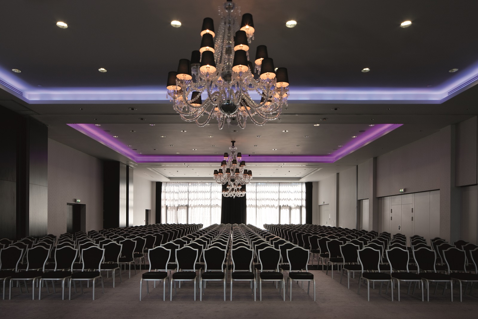 Grand Syon Ballroom with elegant chandeliers, perfect for conferences and events.