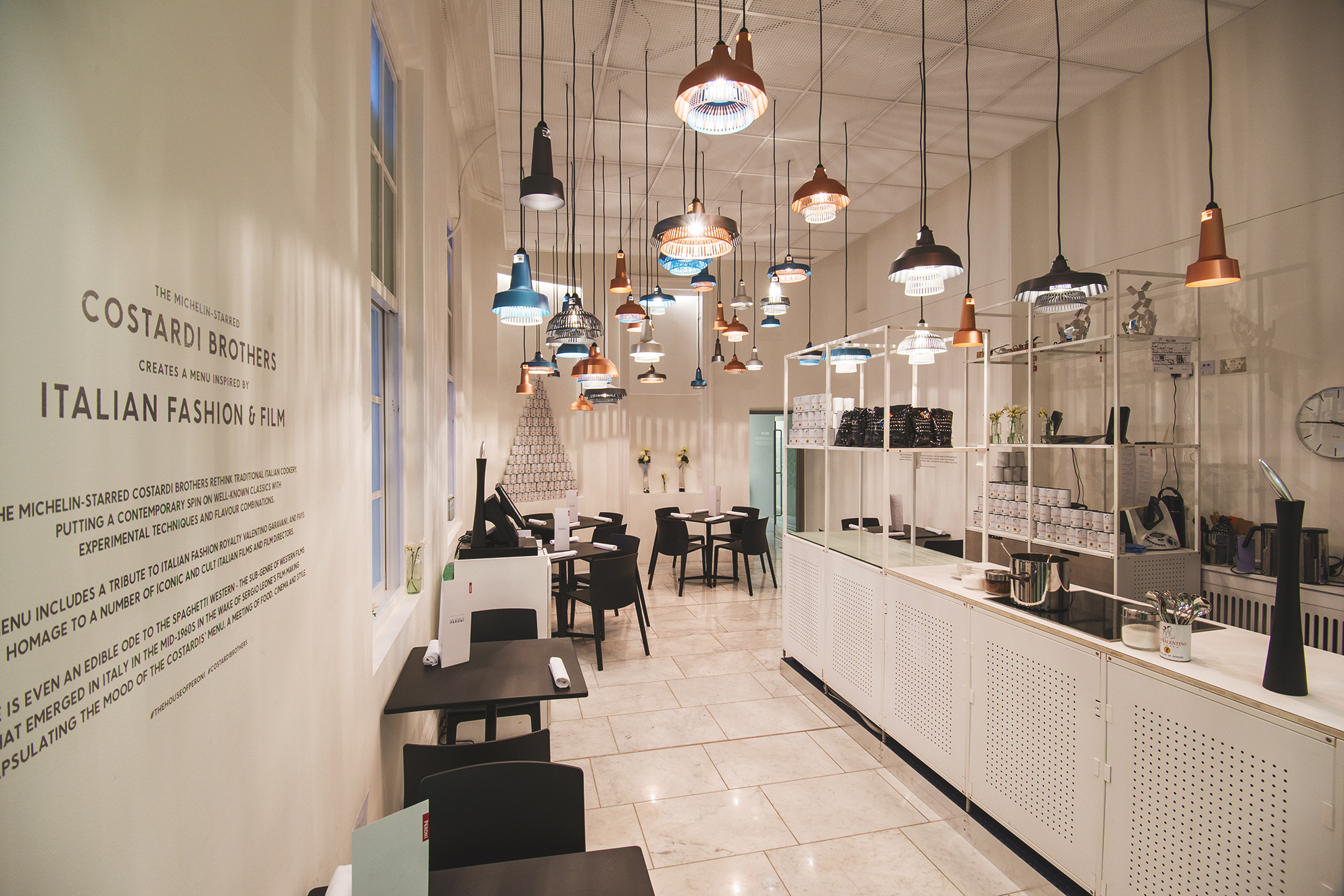 Modern exhibition area with pendant lighting, ideal for fashion showcases and networking events.