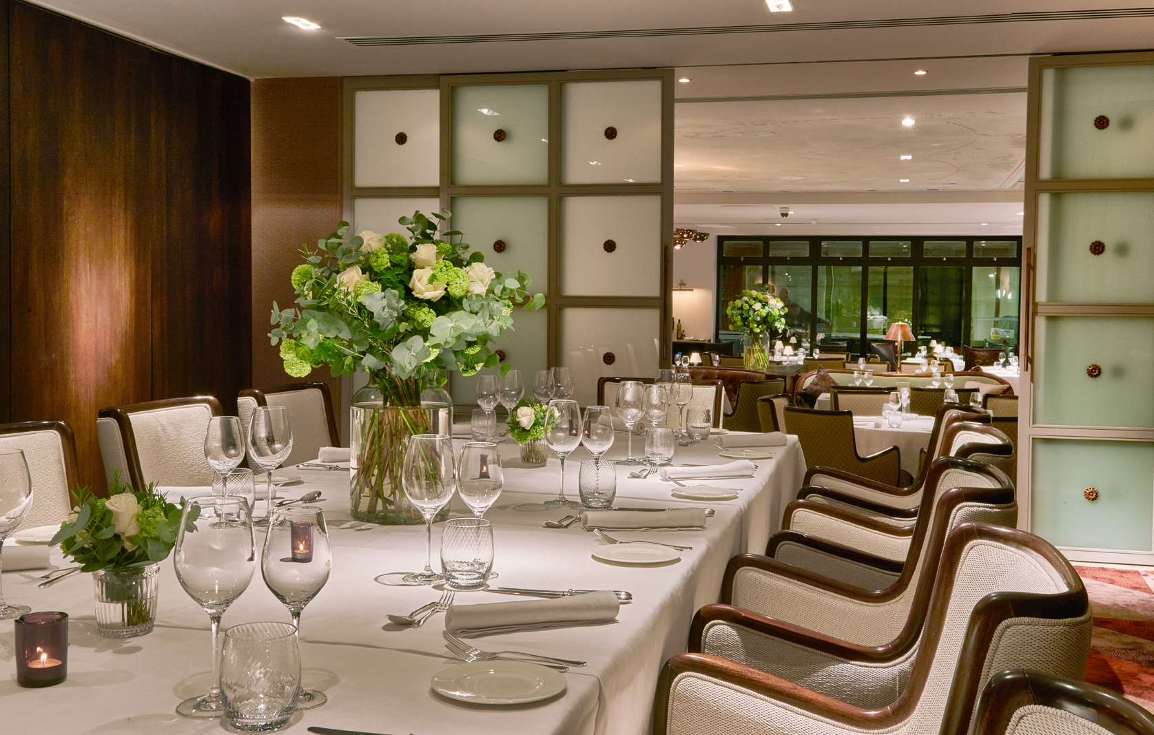 Elegant private dining room with floral decor for upscale events and corporate dinners.