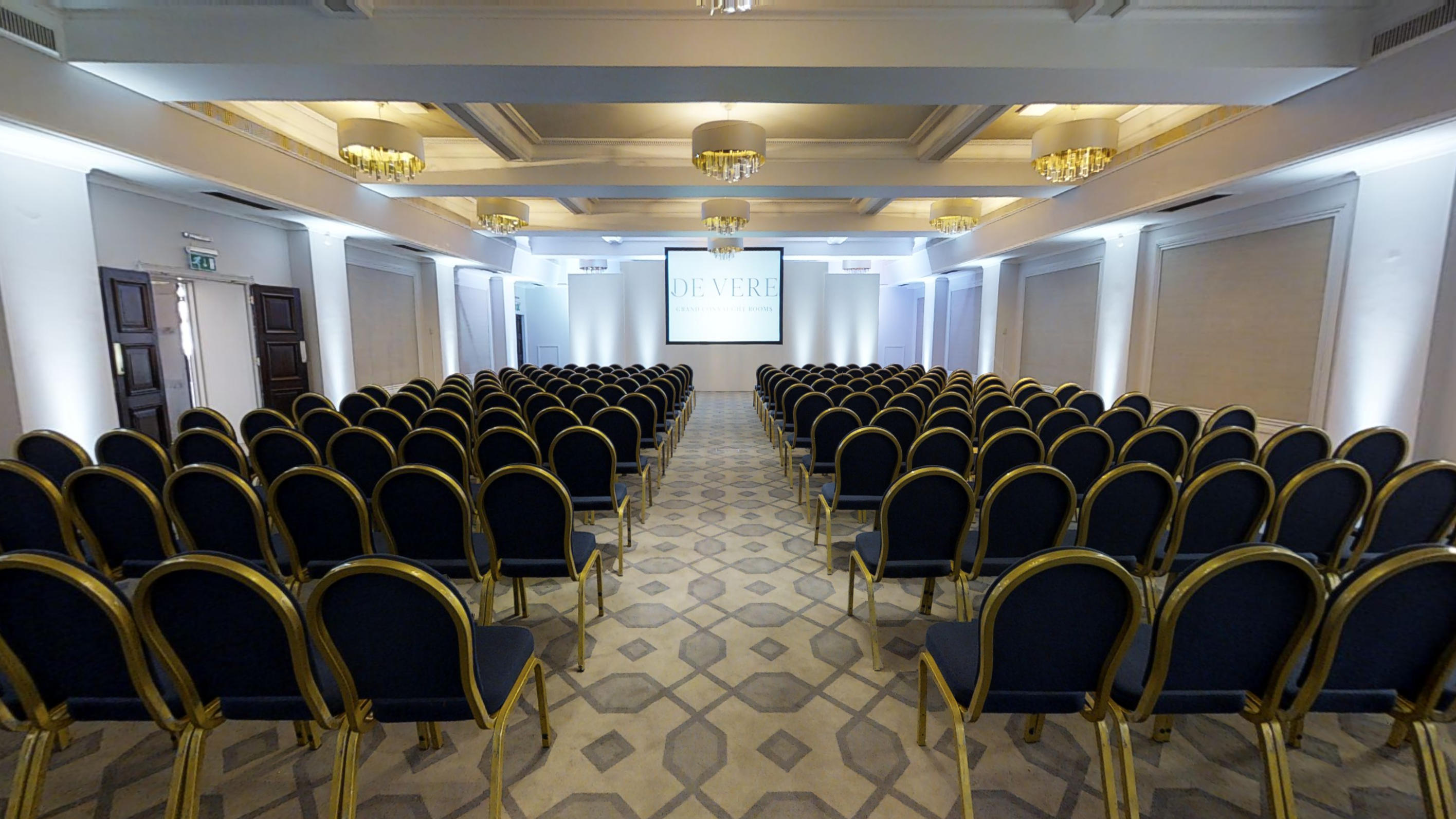 Crown & Cornwall Suite conference room with elegant black chairs, ideal for presentations.