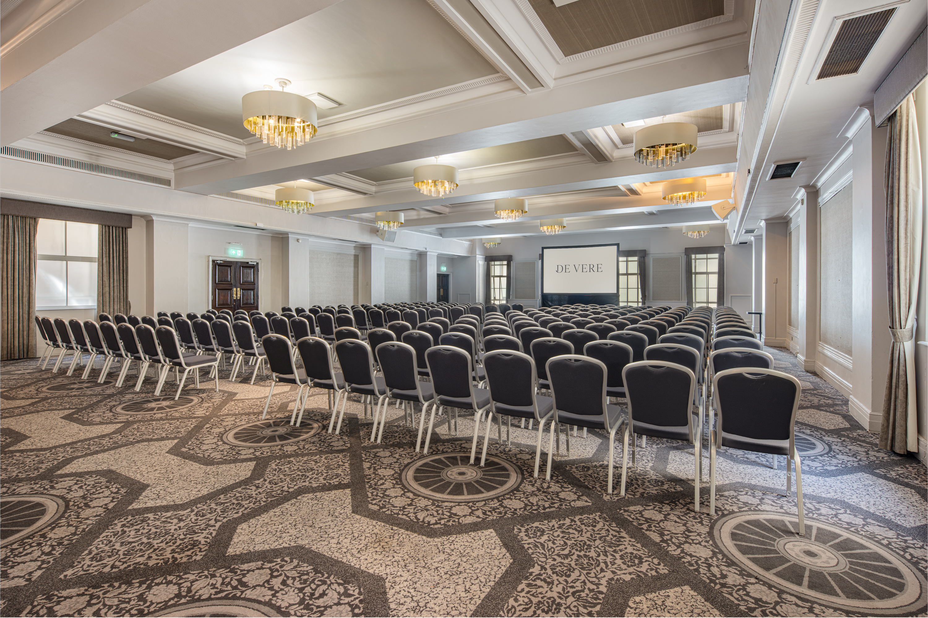 Grand Connaught Rooms ballroom with coffered ceilings for corporate conferences and presentations.