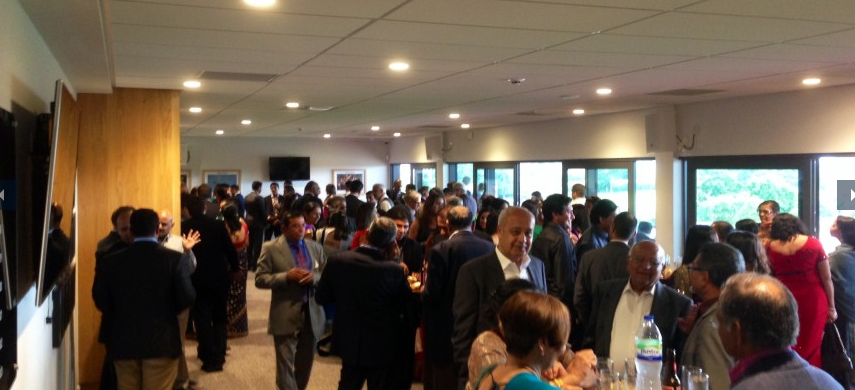 Networking event at Players Lounge, StoneX Stadium; bright, spacious atmosphere.