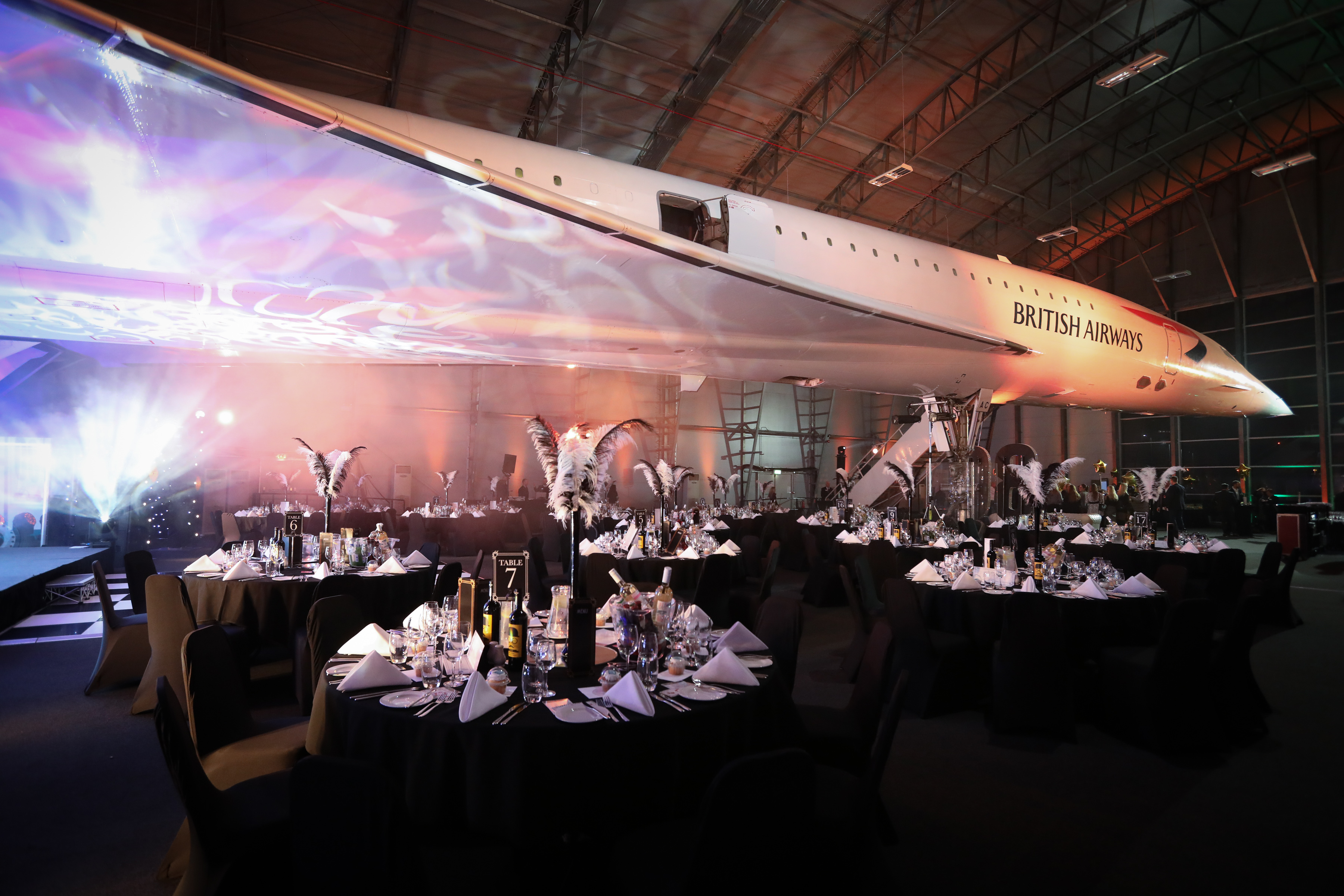 Concorde Hangar event space with Concorde aircraft backdrop for corporate events and galas.
