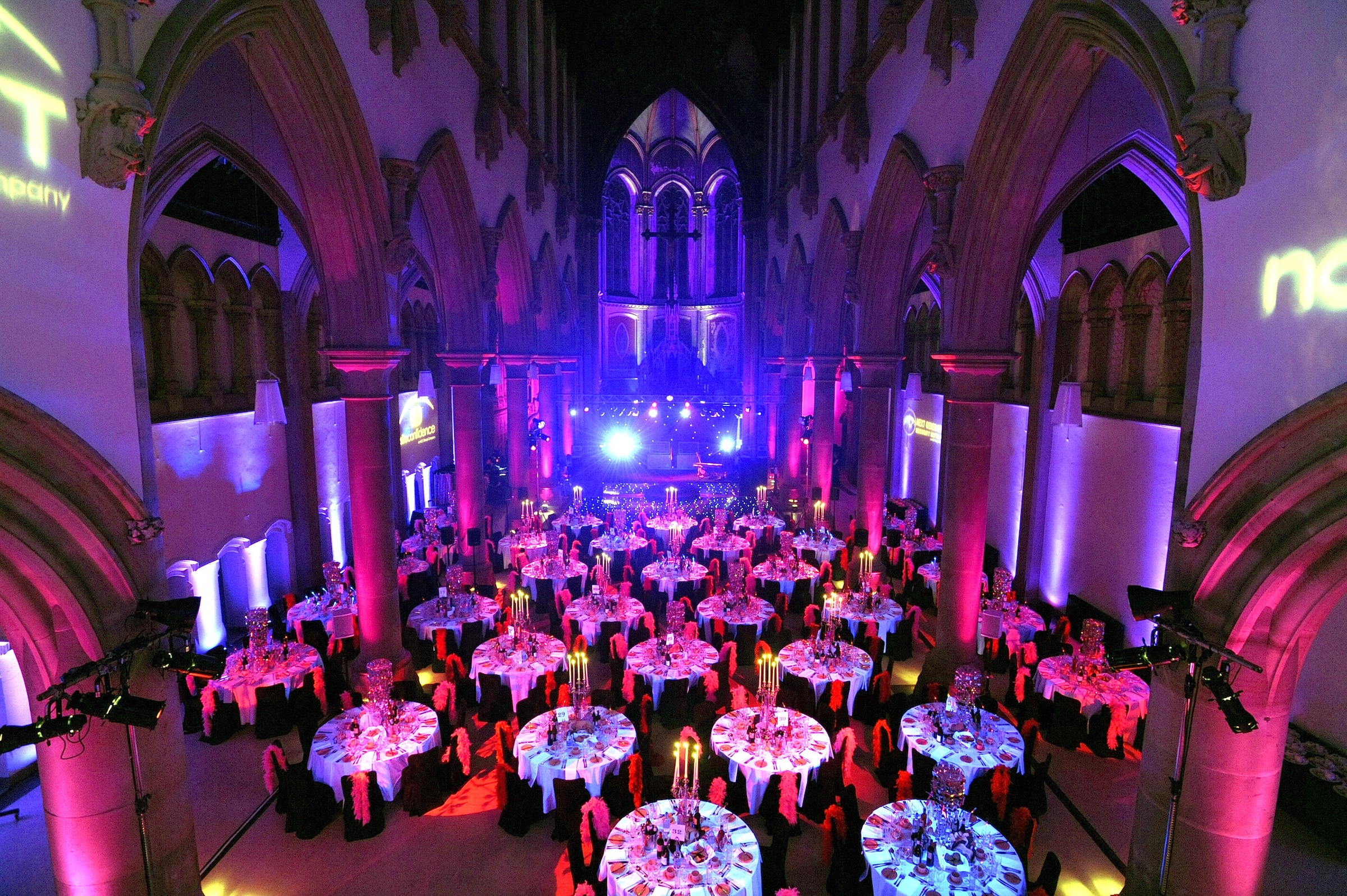 Great Nave, Monastery Manchester: elegant event space with round tables for formal gatherings.