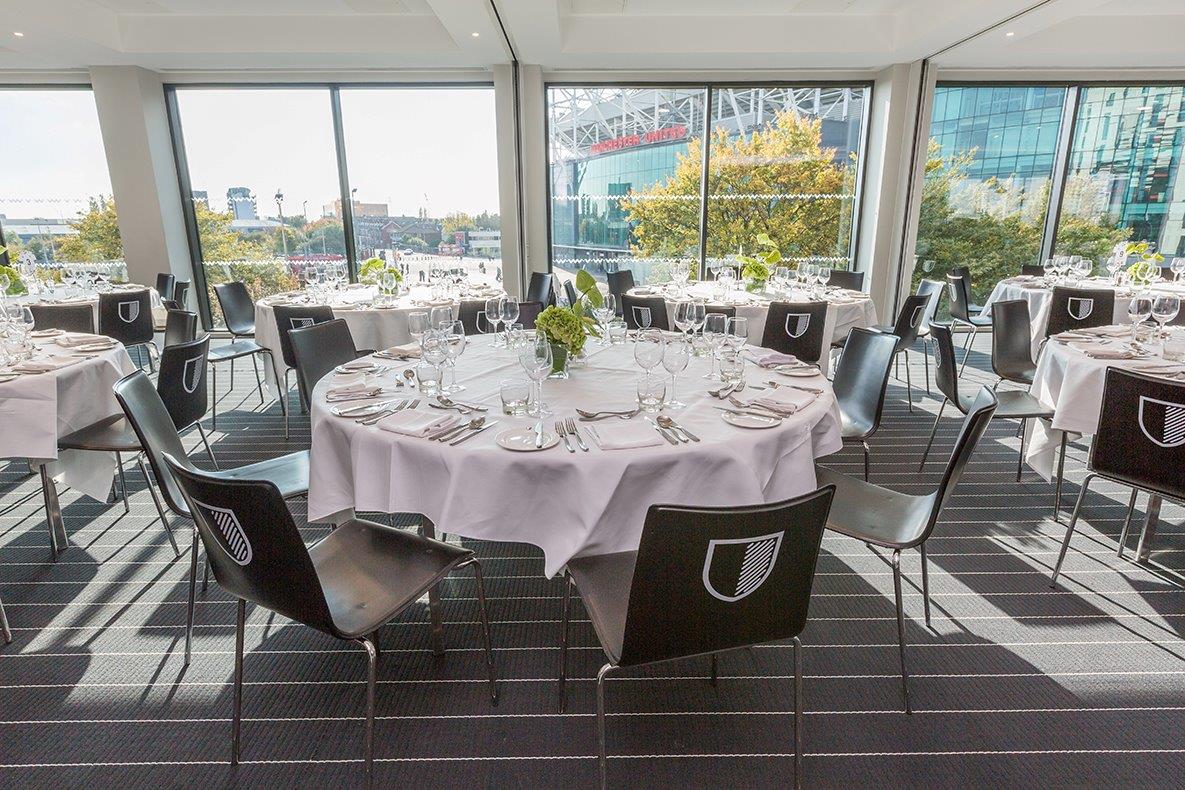 Stadium Suite at Hotel Football, elegant dining setup for corporate events.