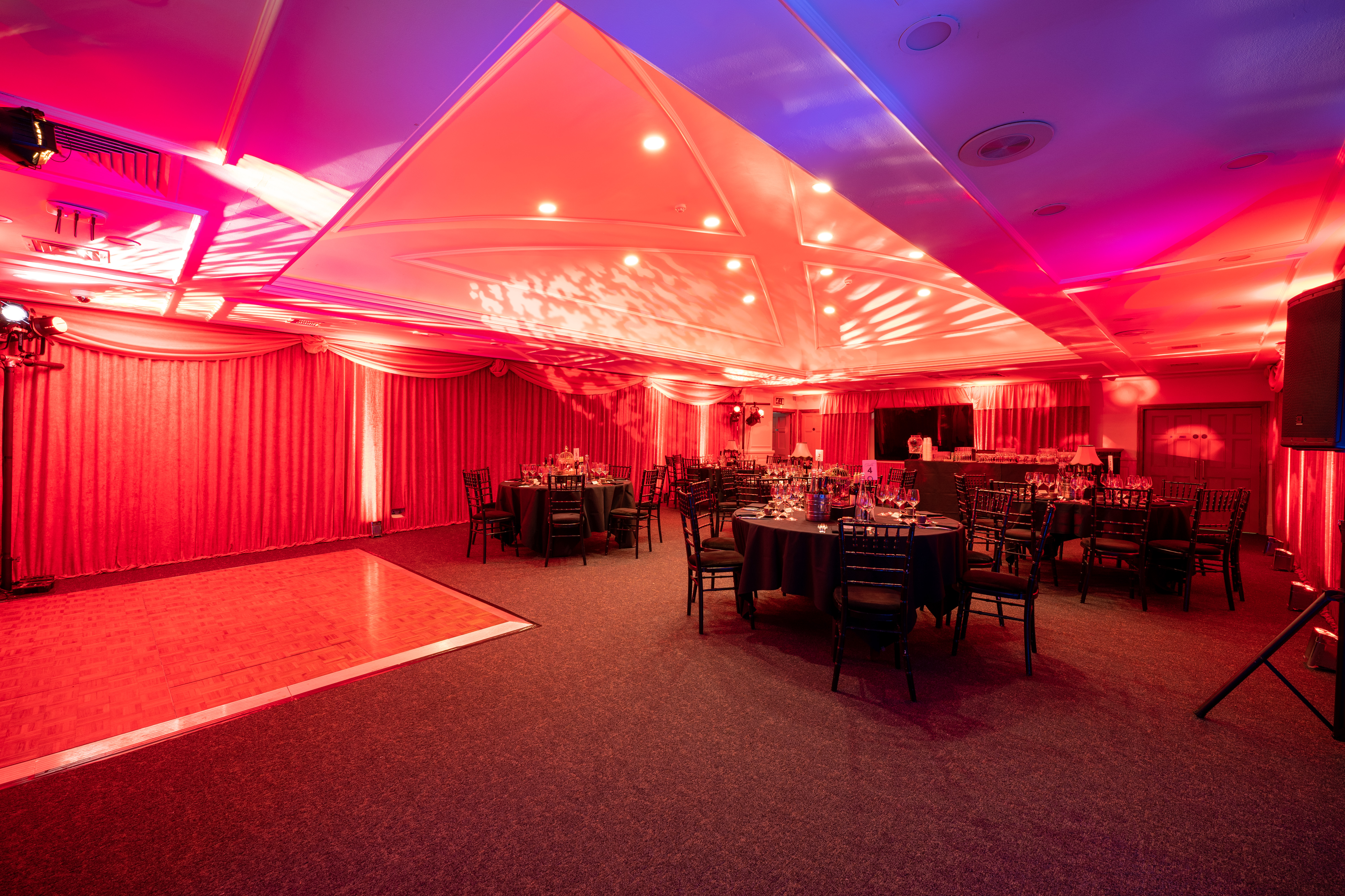 Elegant event space at The James Watt with vibrant lighting for upscale gatherings.
