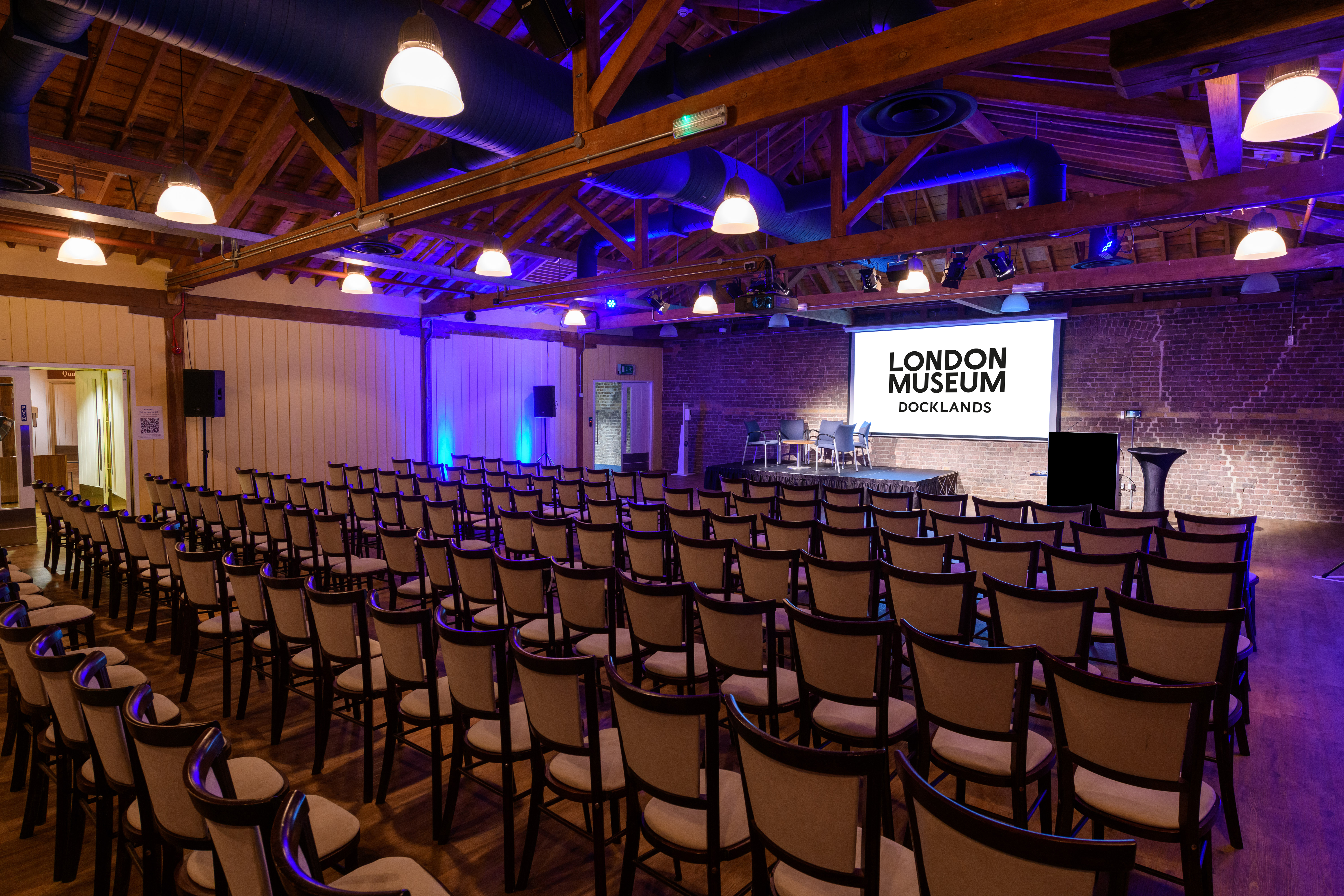 Wilberforce Room at London Museum Docklands, ideal for conferences with elegant seating. - Banner