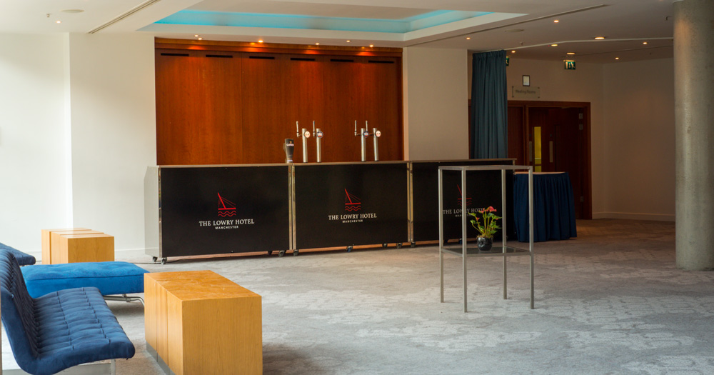 Spacious hotel lobby at The Lowry Hotel for events and gatherings, featuring modern design.