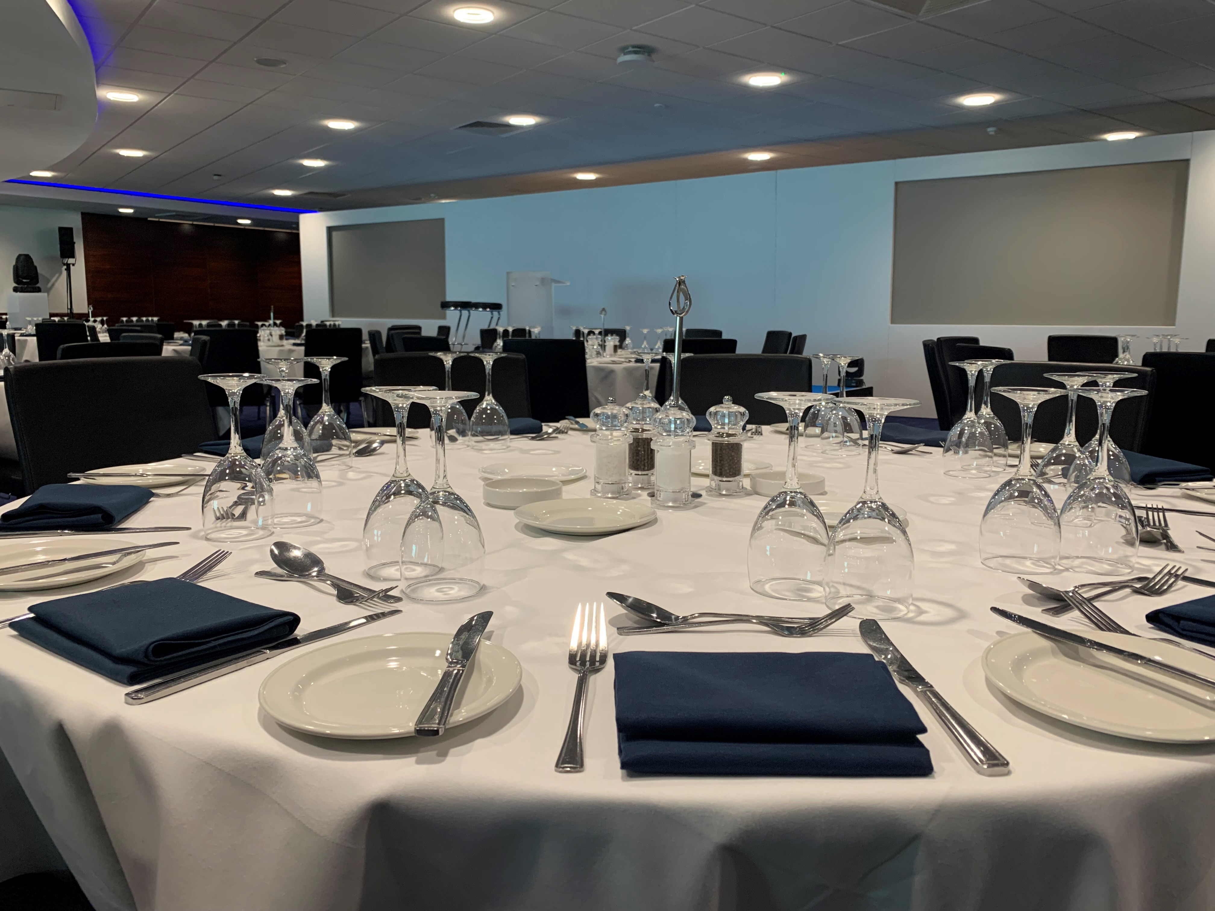 Elegant banquet setup in Chelsea FC's Drake and Harris Suites for corporate events.