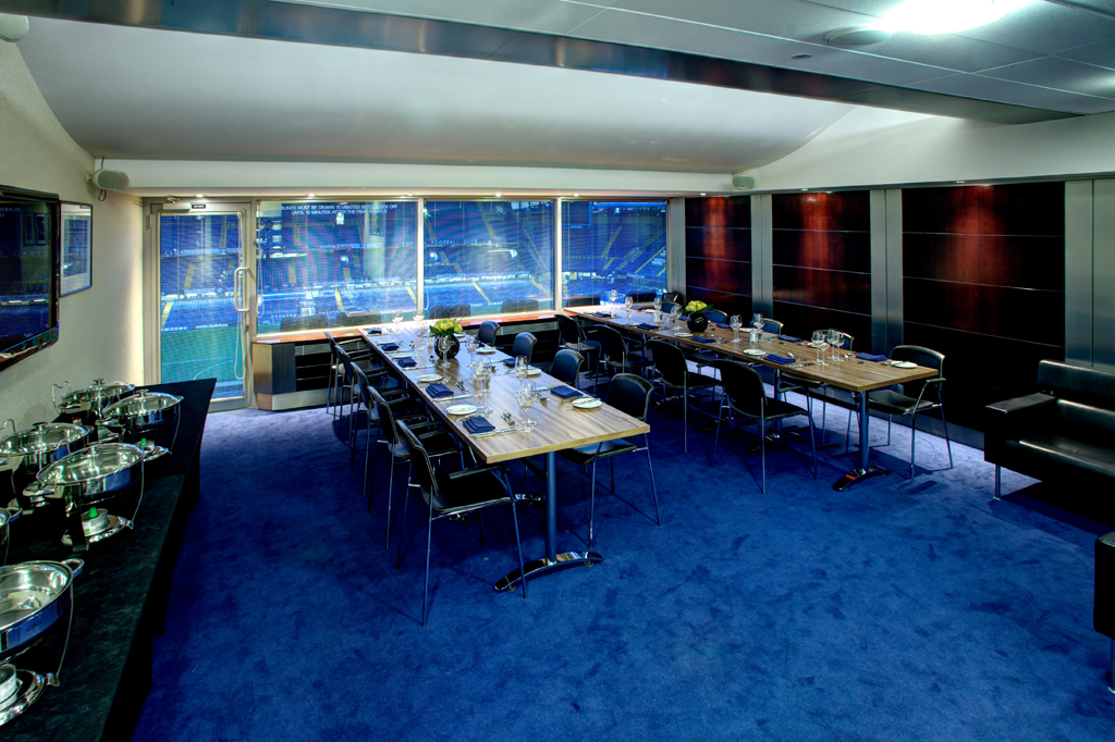 Millennium Suite at Chelsea FC: modern meeting room with stadium view for corporate events.