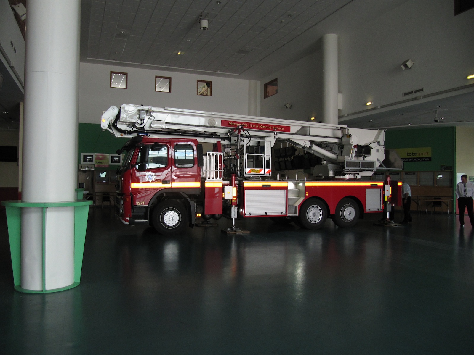 Fire truck in Aintree Racecourse Exhibition Hall for event safety preparedness.