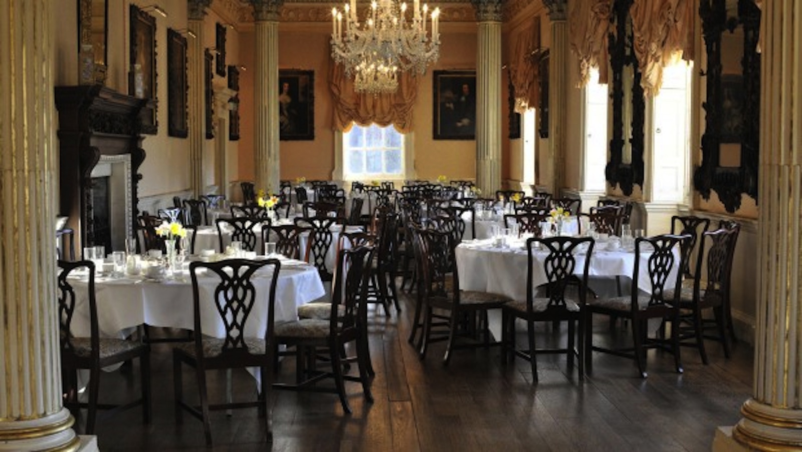 Elegant dining room in Long Gallery, Hagley Hall, set for upscale events with floral centerpieces. - Banner