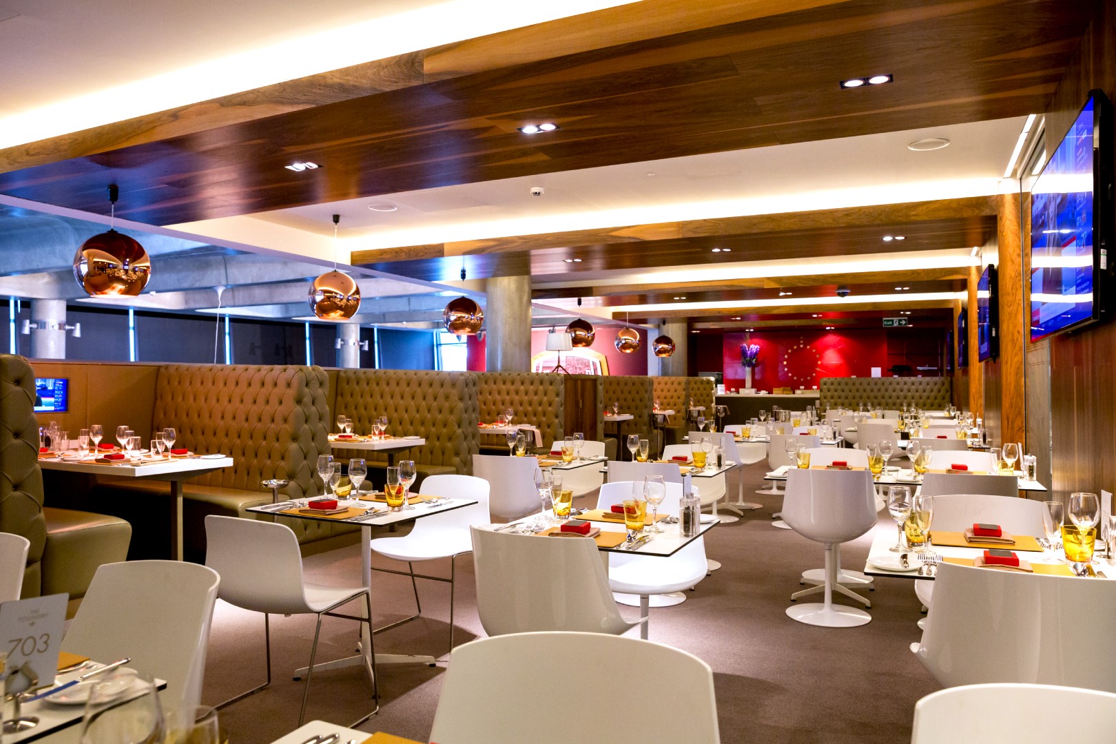 Modern restaurant at Emirates Stadium, ideal for events with elegant decor and seating.