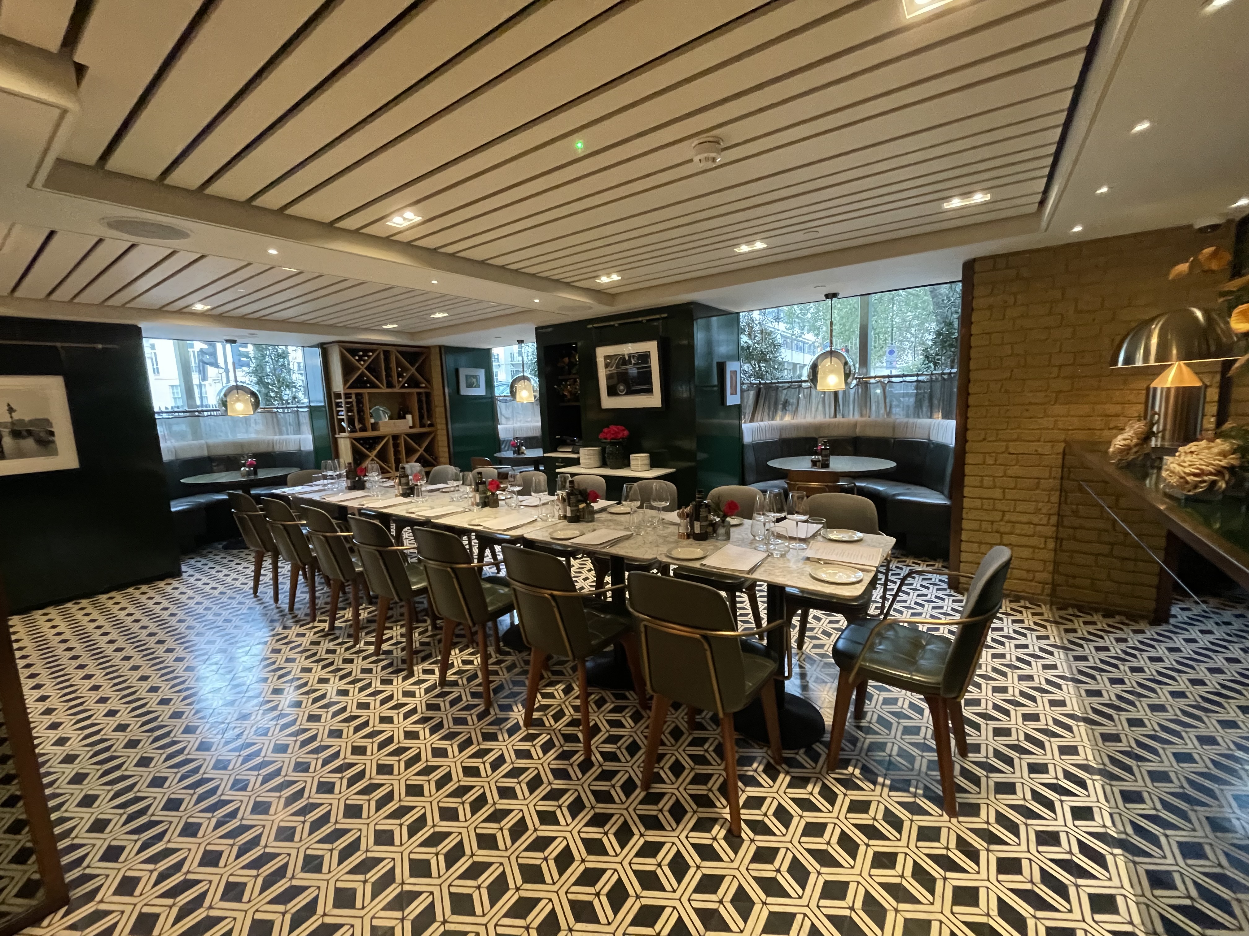 Il Pampero at The Hari: Intimate boardroom meeting space with upscale dining setup.