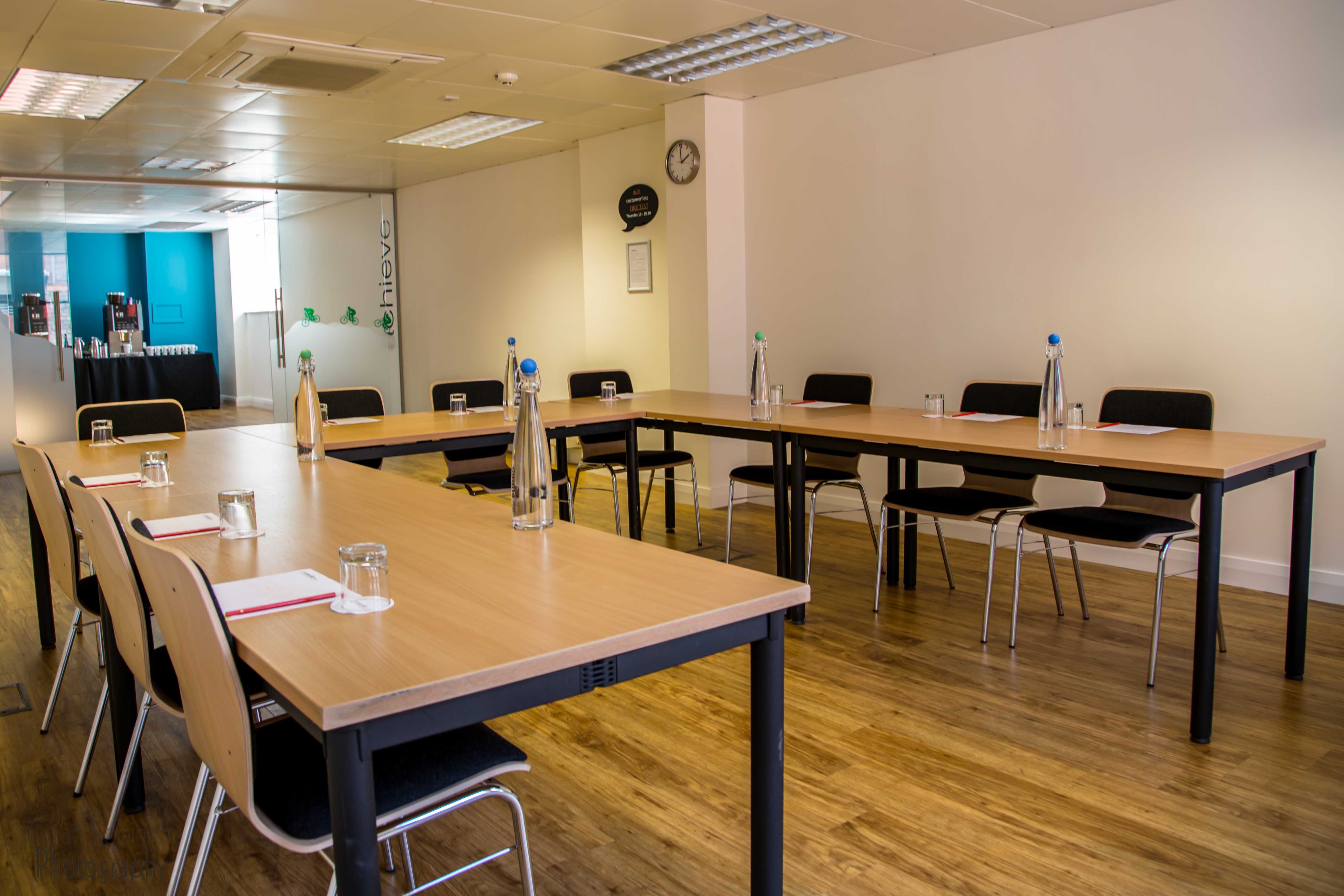 Professional meeting room in Birmingham with natural light, ideal for corporate events.