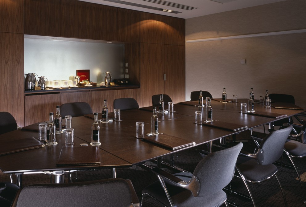 Willow Suite meeting room at Royal Lancaster London, featuring a sleek dark wood table.