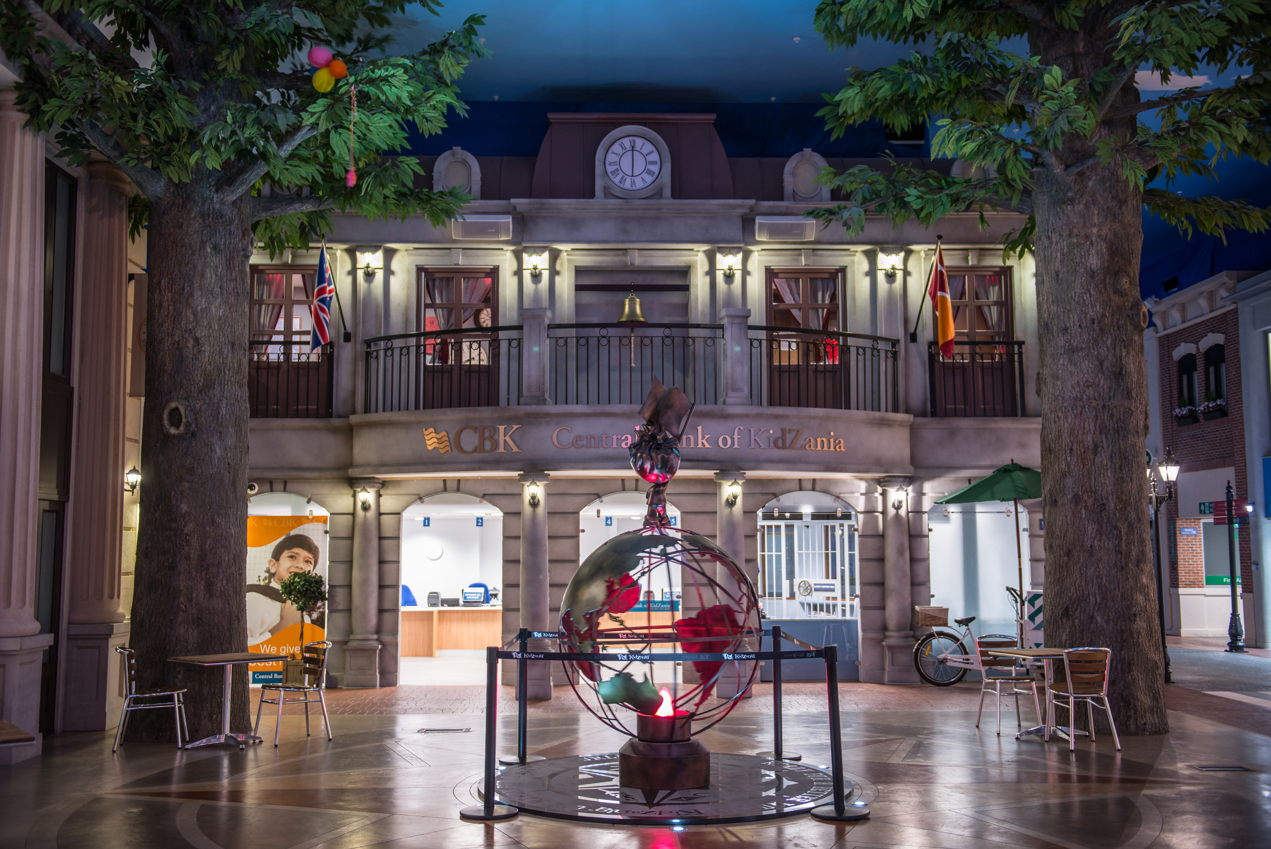 KidZania London Main Square: interactive event space with globe centerpiece for networking.