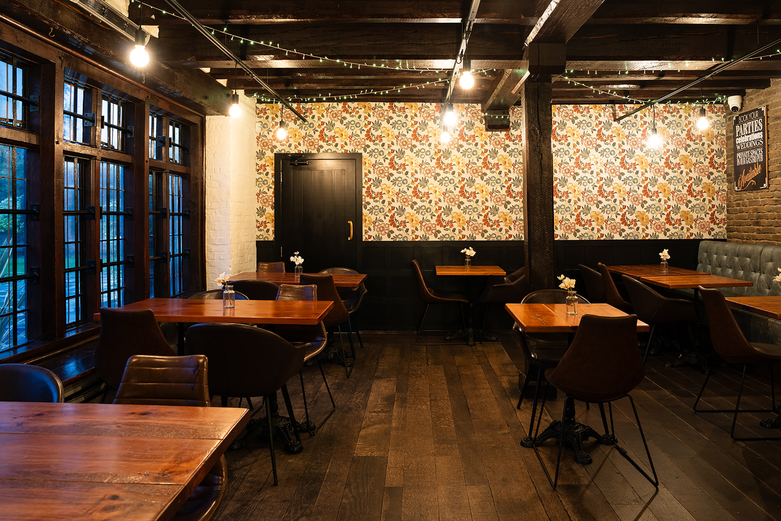 Cozy dining space at Tudor Barn Eltham, perfect for intimate gatherings and meetings. - Banner